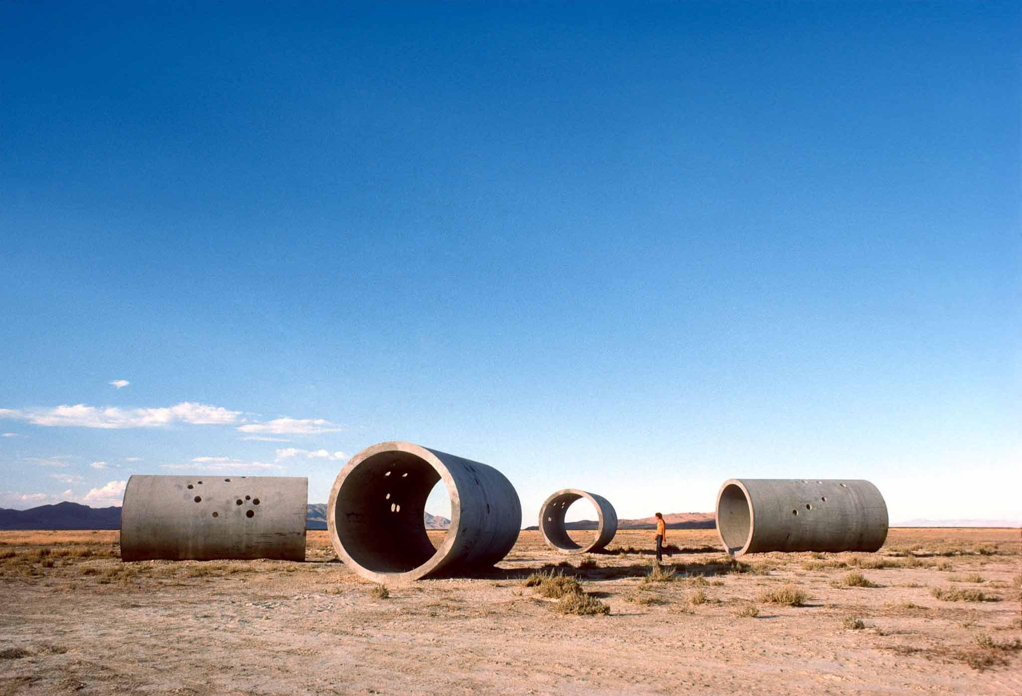An overview of Sun Tunnels with a person for scale.